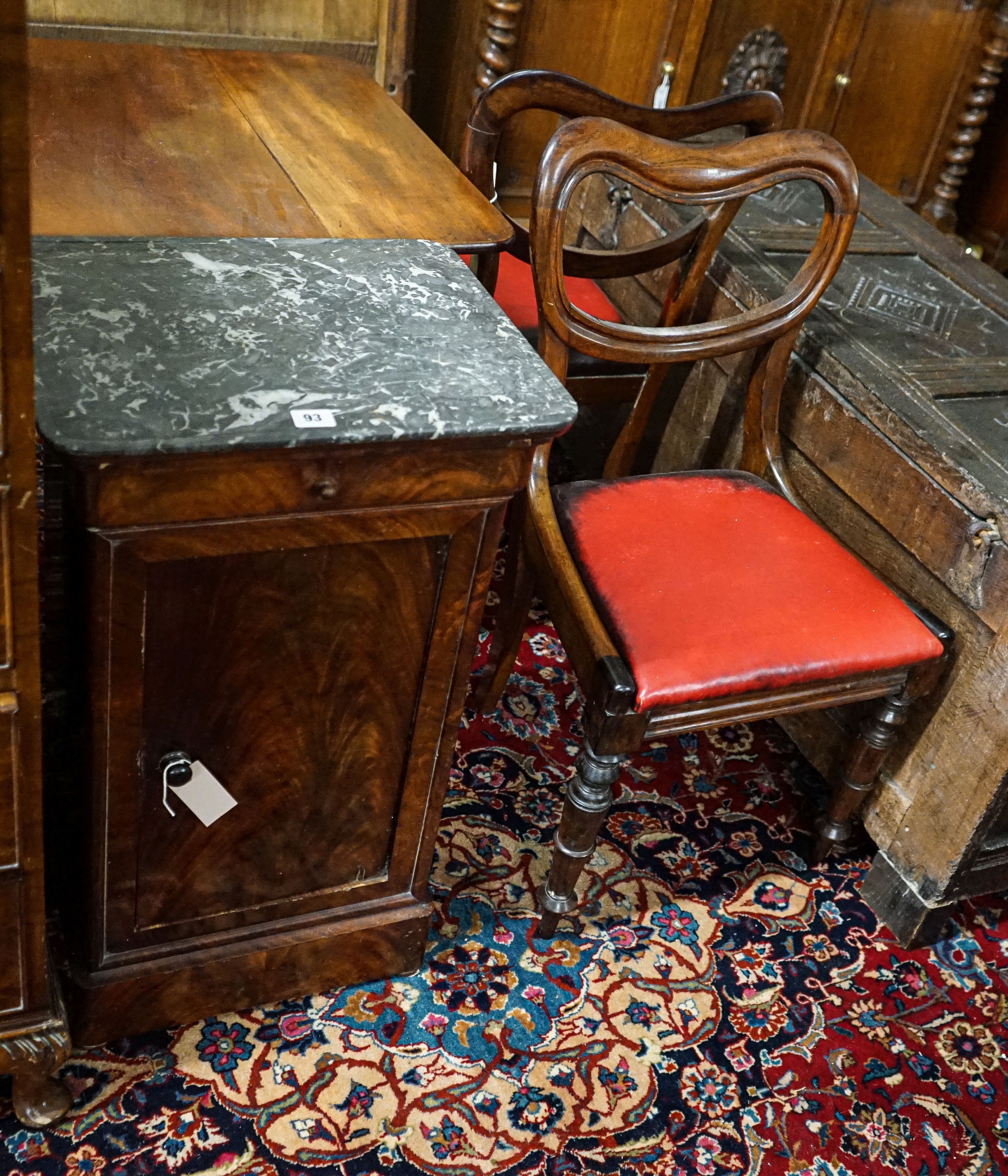 A Victorian mahogany commode cupboard with grey marble top, width 93cm, depth 36cm, height 75cm together with a pair of Victorian rosewood kidney back dining chairs